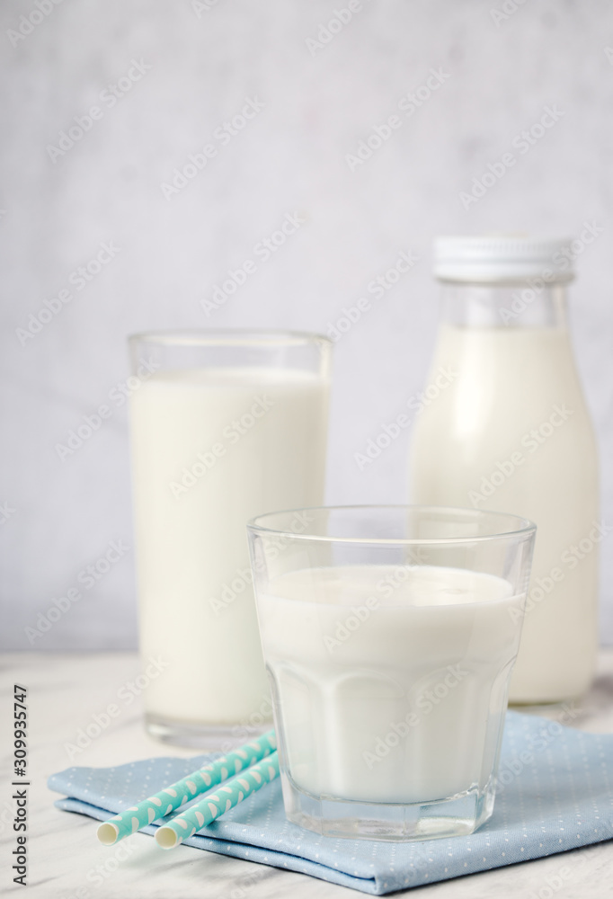 Dairy products, health concept, in glassware, on a light gray background Dairy products, health concept, in glassware, on a light gray background