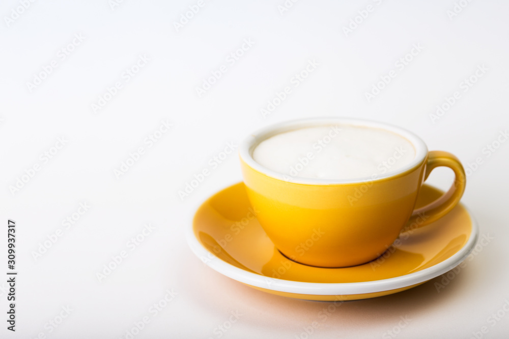 yellow cup on a white background yellow cup on a white background