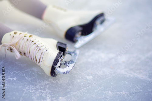 Photography Children's figure skates on an ice rink close-up