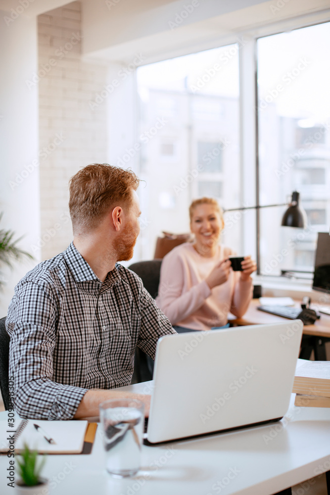 Businessman at office working. Attractive red hair businessman. Businessman at office working. Attractive red hair businessman.
