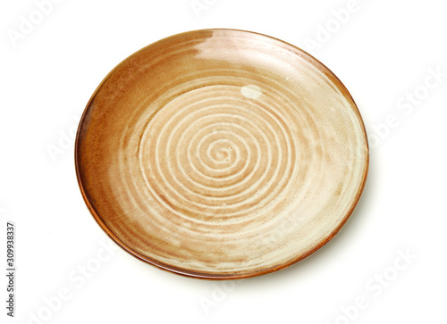 Empty earthenware plate on white background