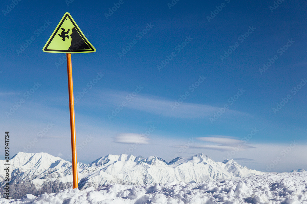 warning sign on the precipice of the ski resort snow winter warning sign on the precipice of the ski resort snow winter