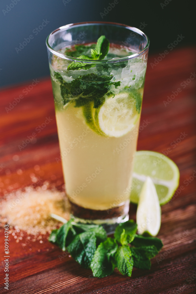 Mojito cocktail with lime and mint in glass Mojito cocktail with lime and mint in glass