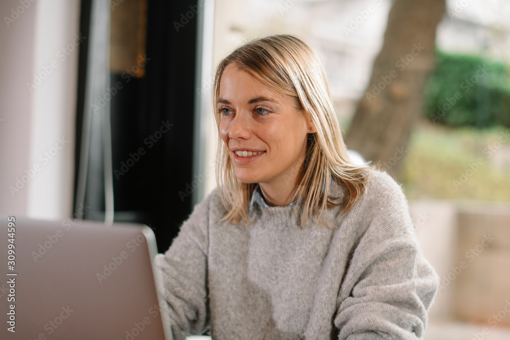 Young woman working in coffee shop. Beautiful female freelancer. Young woman working in coffee shop. Beautiful female freelancer.