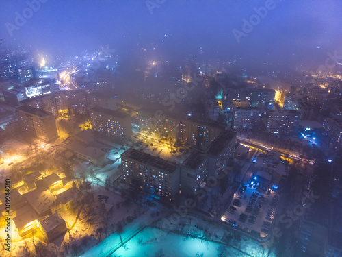 The city Chisinau in winter  at night with lights. Aerial view