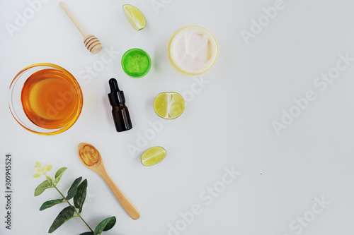 Wallpaper Mural Wellness cosmetic package containers with green leaves, natural herbal ingredient. natural organic beauty product concept mock up. Blank bottle for label own branding skincare. isolated white backgrou Torontodigital.ca