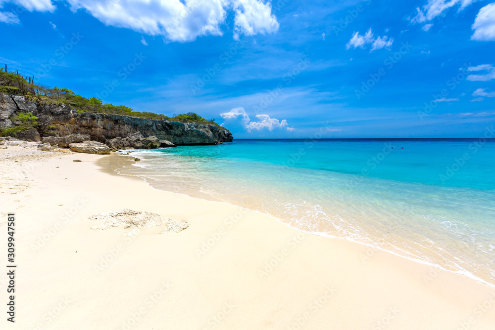 Little Knip beach - paradise white sand Beach with blue sky and crystal clear blue water in Curacao, Netherlands Antilles, a Caribbean tropical Island