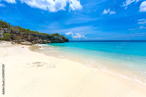Little Knip beach - paradise white sand Beach with blue sky and crystal clear blue water in Curacao  Netherlands Antilles  a Caribbean tropical Island