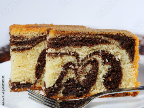 Chocolate marble cake slices on white plate