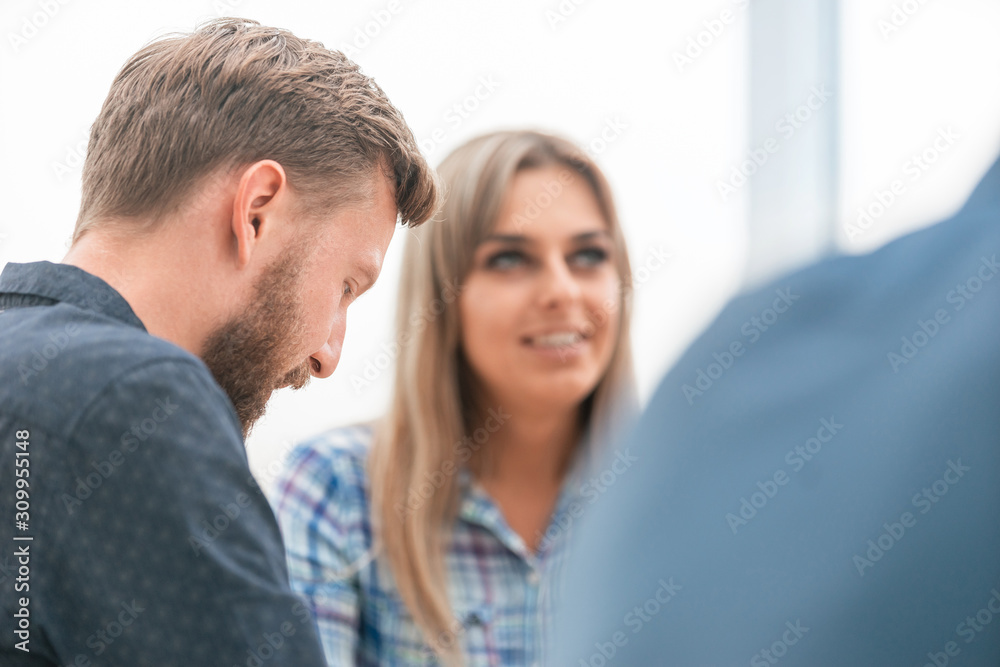 close up. two employees sitting at the Desk close up. two employees sitting at the Desk