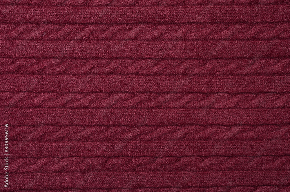 Fototapeta premium texture of wine woolen knitted sweater near background