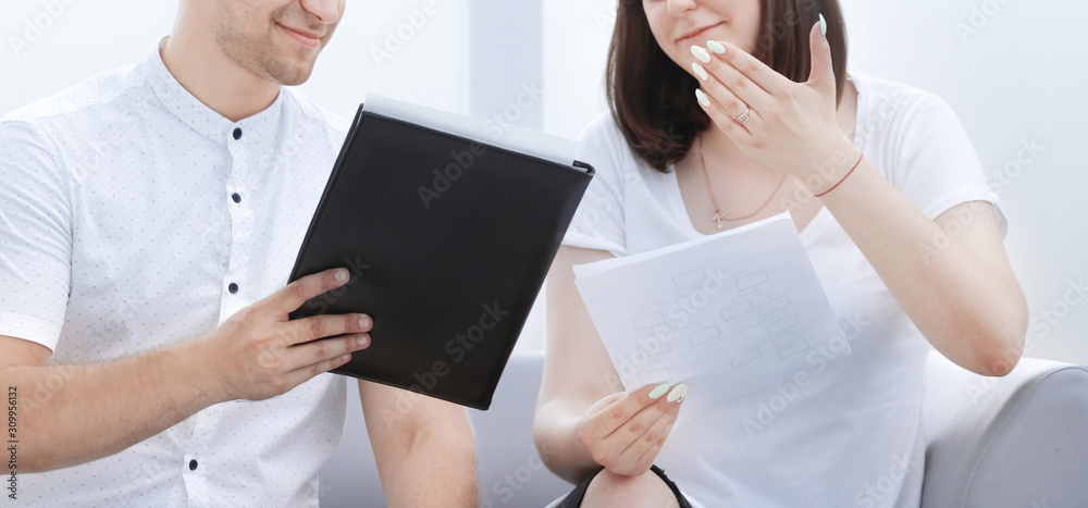 business colleagues discussing new business documents in the office lobby business colleagues discussing new business documents in the office lobby