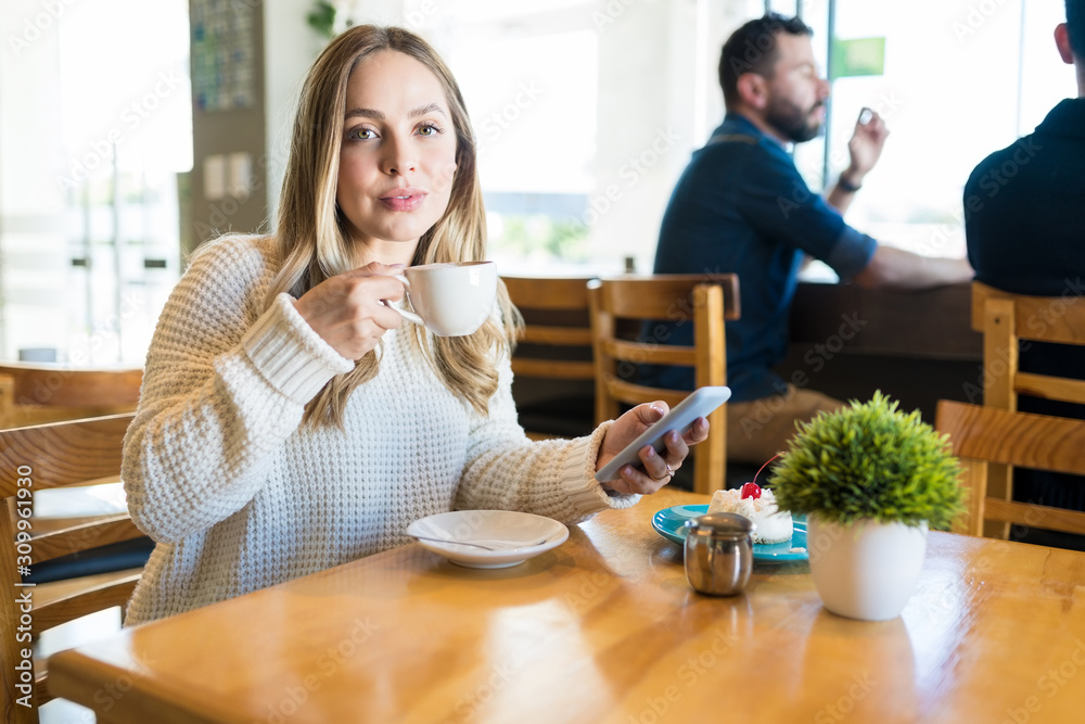 Portrait Of Woman With Coffee Cup And Smartphone At Cafe Portrait Of Woman With Coffee Cup And Smartphone At Cafe