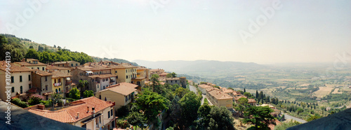 Panoramic view from a hill in Umbria in summertime with a village and a lot of trees photo