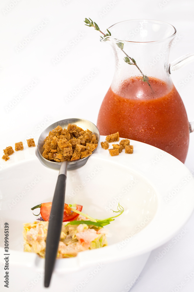 Tomato soup in a restaurant decorated with shrimp 