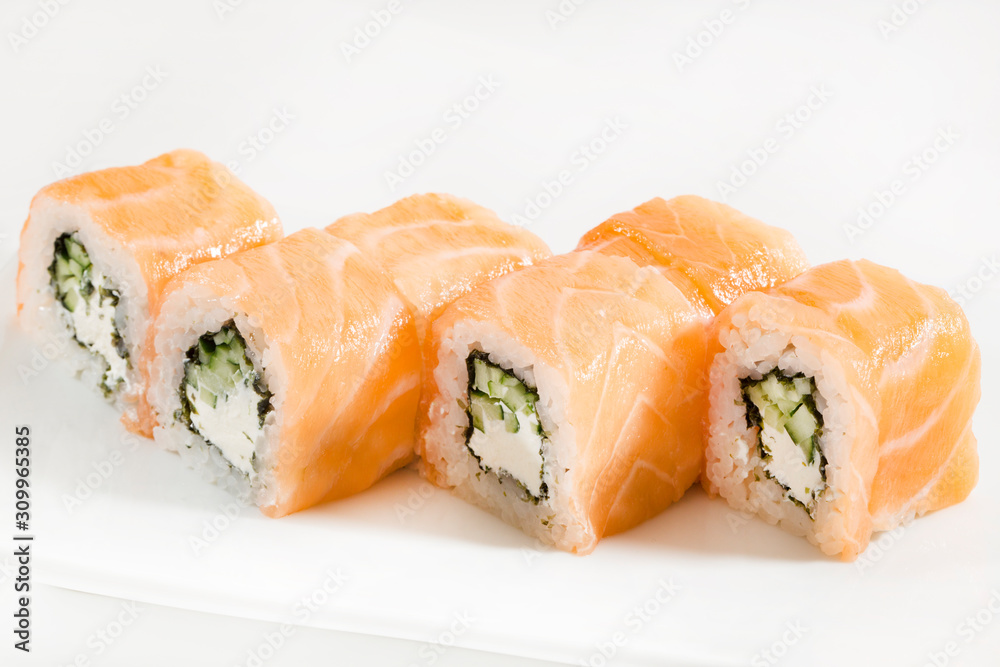 Sushi with seafood and vegetables on a white background in the restaurant Sushi with seafood and vegetables on a white background in the restaurant