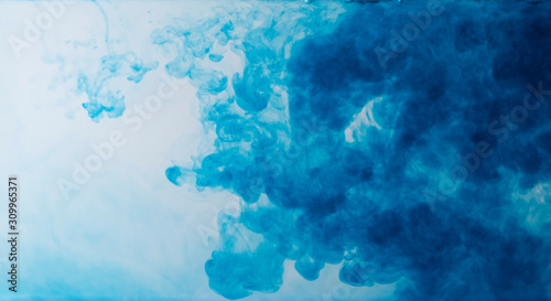Blurred colors are melting in water to be blue background