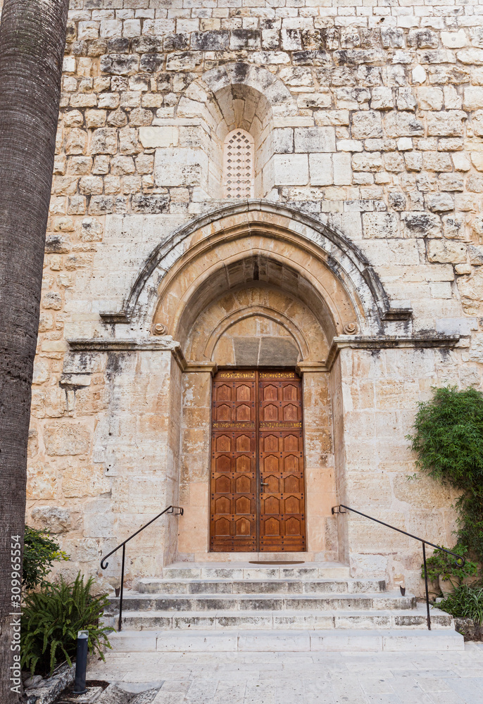 Entrance doors to the Benedictine Abbey of Abu Gosh in the Chechen village Abu Ghosh near Jerusalem in Israel Entrance doors to the Benedictine Abbey of Abu Gosh in the Chechen village Abu Ghosh near Jerusalem in Israel