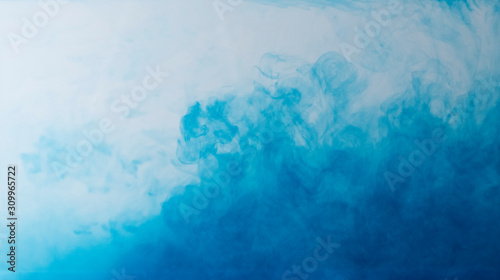Blurred colors are melting in water to be blue background