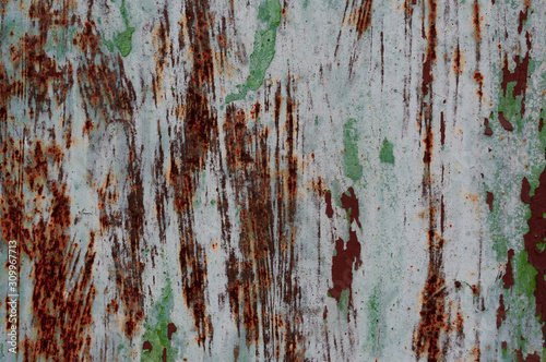 white, green and orange painted scratched and cracks rusty grundy textured surface for background