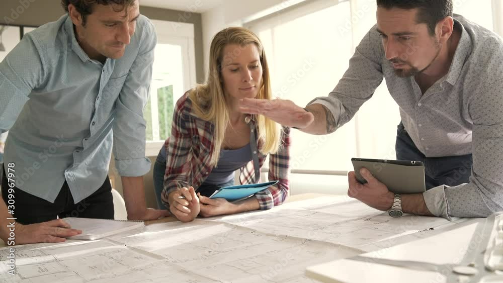 Architects in office working on project