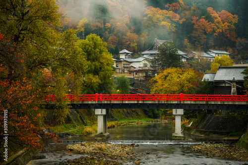Takayama Red old and historical bridge in the morning of autumn