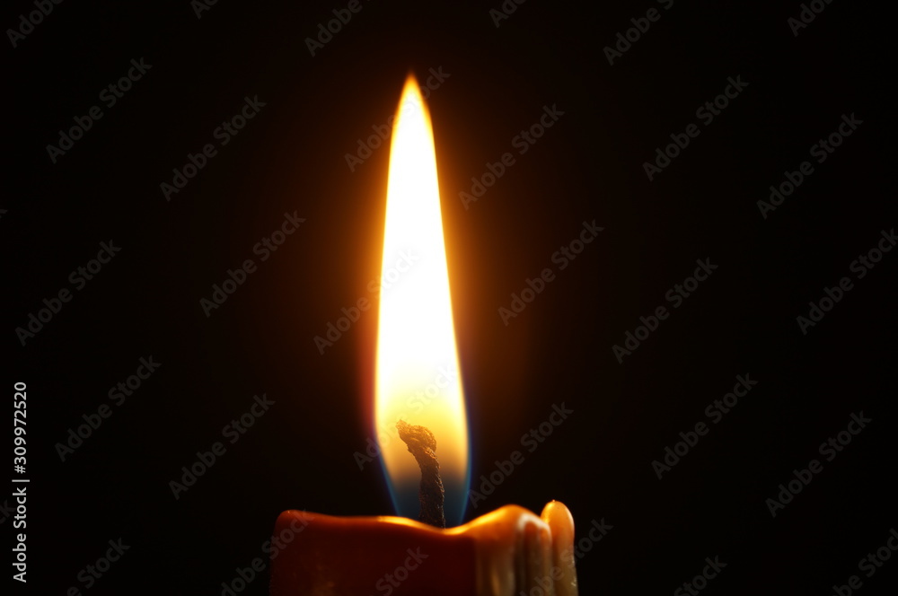 Extreme closeup on candle lit match on black background. Extreme closeup on candle lit match on black background.
