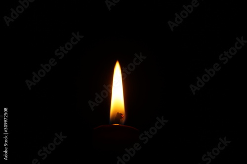 Candle flame on black background. Flame alone.
