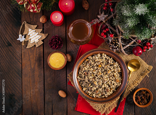 Kutya. Christmas porridge made of wheat grains, poppy seed, nuts, raisins and honey. Christmas kutia. Ukrainian cuisine. Top view, overhead