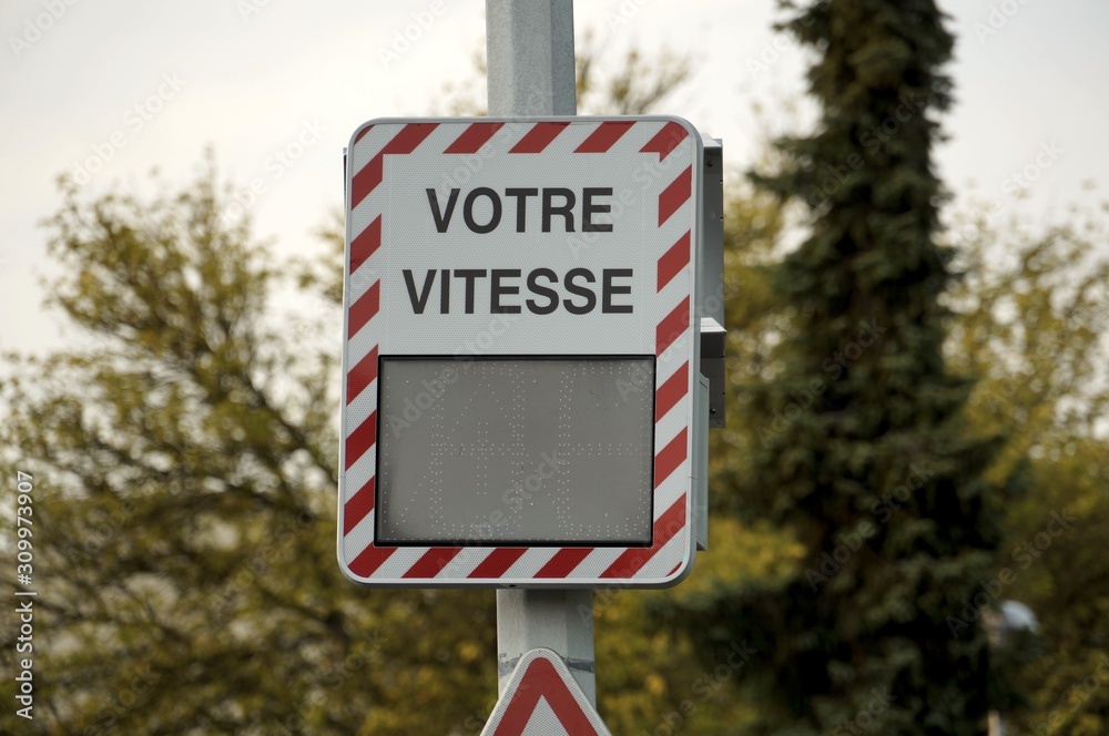 Empty french speed indicator device on roadside. Prevention of over speed in city. Ready to be personalized by your own indications.