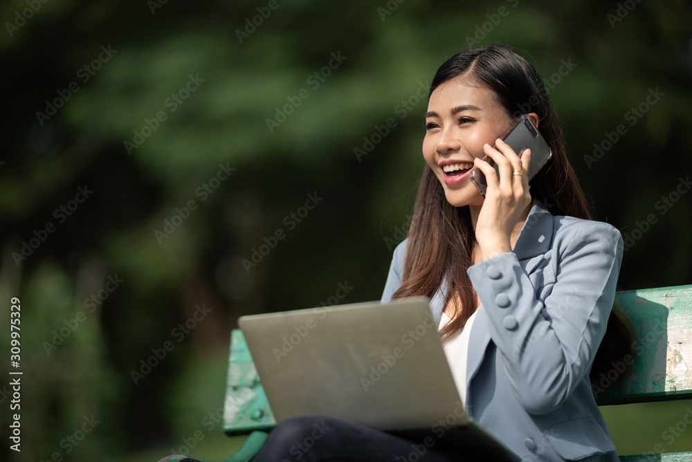 businesswomen working with laptop in the garden morning with coffee cup businesswomen working with laptop in the garden morning with coffee cup