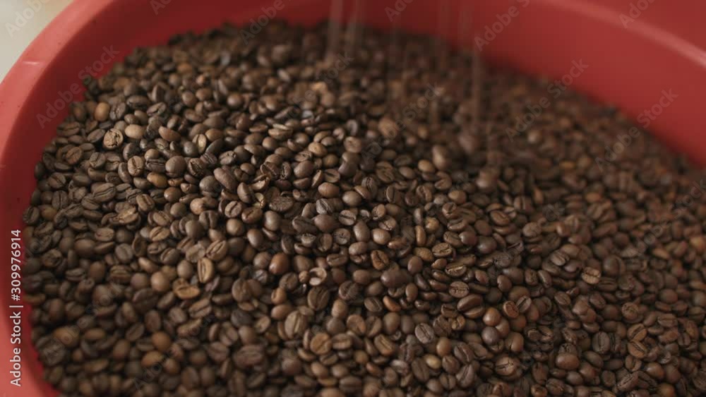 Close view of pouring coffee beans into bowl. 4K Close view of pouring coffee beans into bowl. 4K