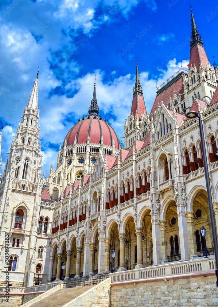 Fototapeta premium The Hungarian Parliament Building located on the Danube River in Budapest Hungary at sunset.