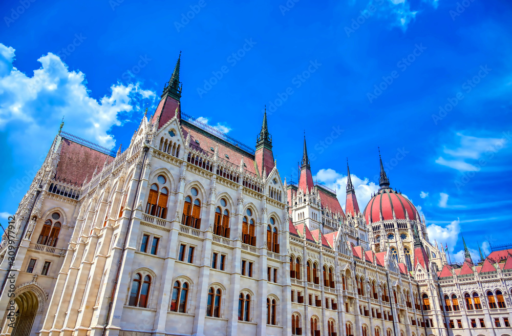 Fototapeta premium The Hungarian Parliament Building located on the Danube River in Budapest Hungary at sunset.
