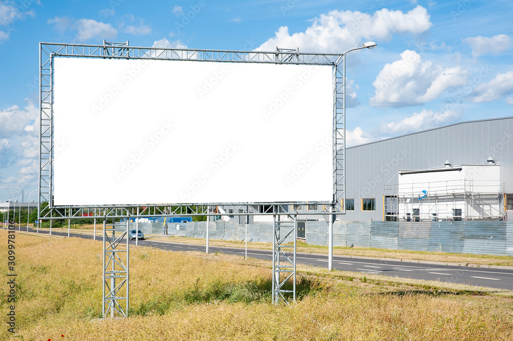 Blank white billboard for advertisement in the front of industrial building. Blank white billboard for advertisement in the front of industrial building.