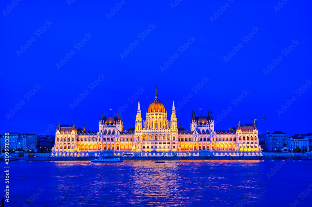 Fototapeta premium The Hungarian Parliament Building located on the Danube River in Budapest Hungary at sunset.