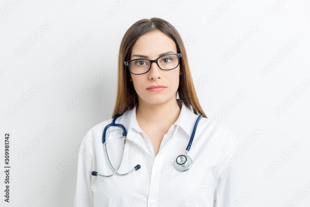 Portrait of a professional female doctor in a coat on a white background. Portrait of a professional female doctor in a coat on a white background.