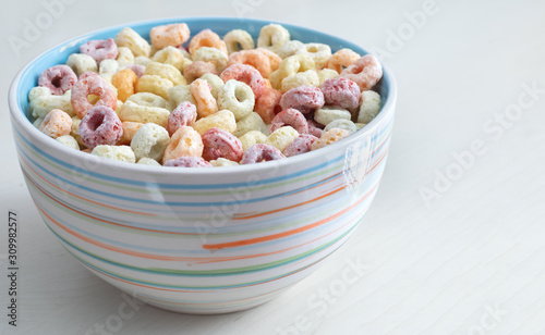 Delicious and nutritious colorful cereal with fruit favor in colorful bowl