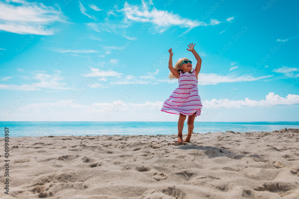 cute happy little girl dance play at summer beach cute happy little girl dance play at summer beach