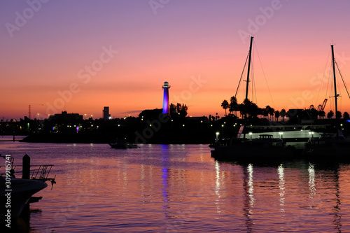 Long Beach Lighthouse at Sunset with Boats in Harbor