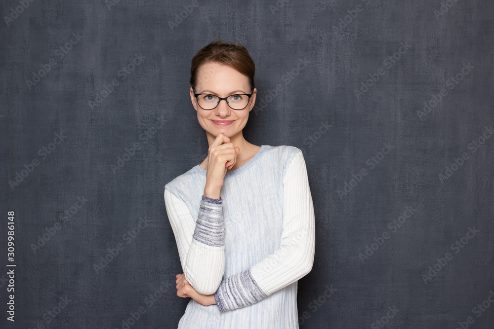Portrait of happy joyful young woman touching chin with hand Portrait of happy joyful young woman touching chin with hand