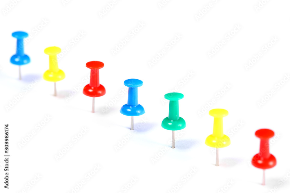 line of push pins isolated on white background with copy space for your text line of push pins isolated on white background with copy space for your text
