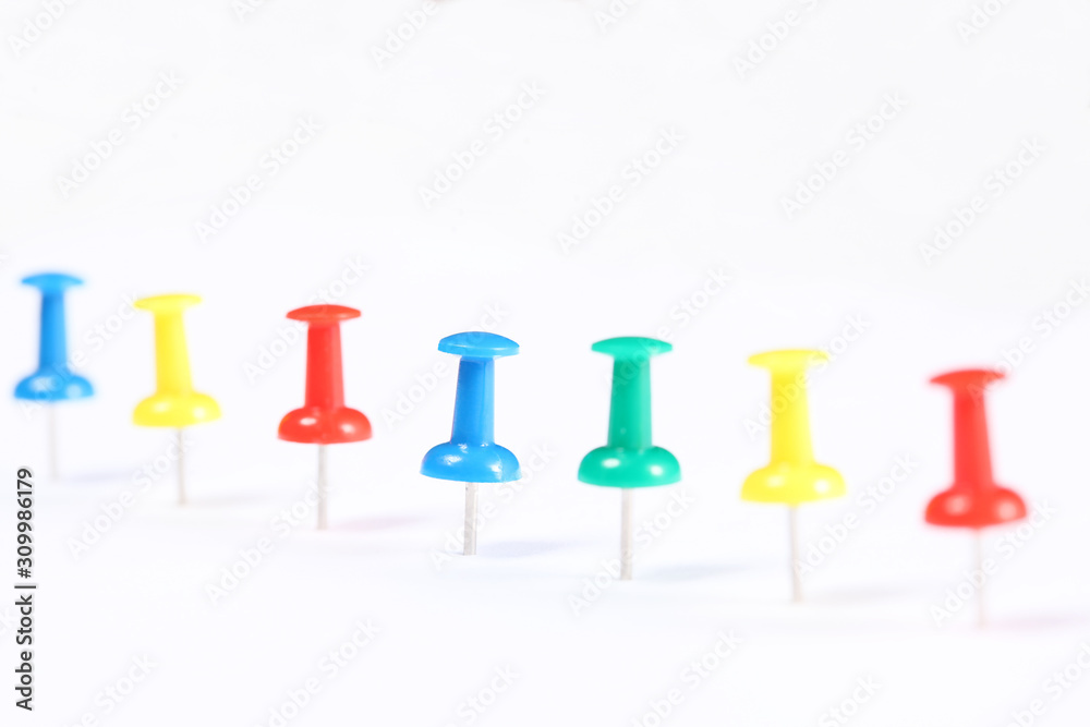 line of push pins isolated on white background with copy space for your text line of push pins isolated on white background with copy space for your text
