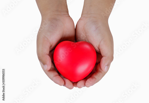 Red heart on hand on white background.