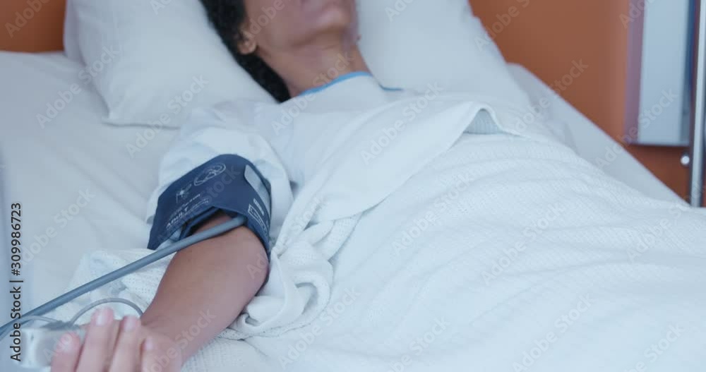 Female patient in a hospital bed Female patient in a hospital bed