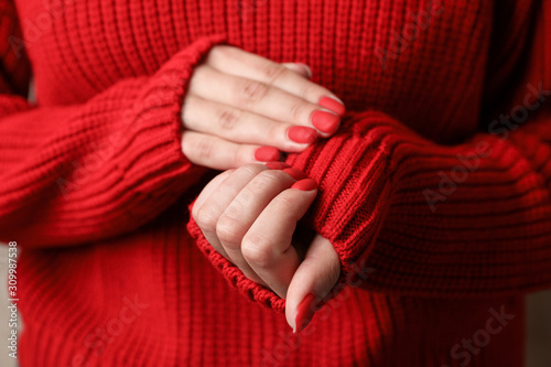 Woman hands, stylish red manicure, space for text. Closeup