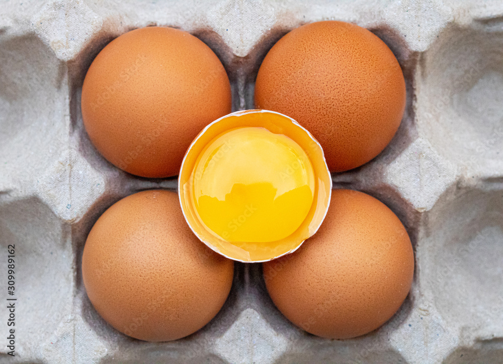 Fresh chicken eggs placed on a paper egg tray. Concept of high protein food, components of healthy food. Fresh chicken eggs placed on a paper egg tray. Concept of high protein food, components of healthy food.