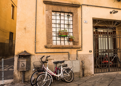 Old typical house exterior with flowers and bicycles