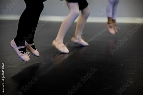 Jumping girl feet in ballet tights and shoes