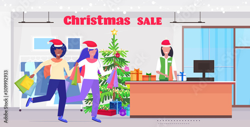 girls in santa hats with shopping bags standing at cash desk with female cashier christmas sale holidays celebration concept modern fashion boutique interior full length horizontal vector illustration